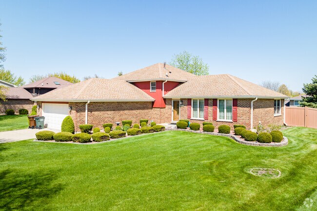 Split-level homes with clean-cut shrubbery are a frequent sight in Frankfort Square.