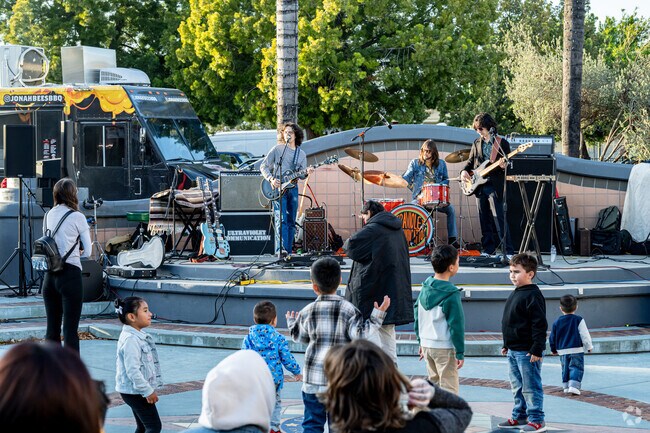 Kids and families enjoy the live bands at the 909 Open Market.