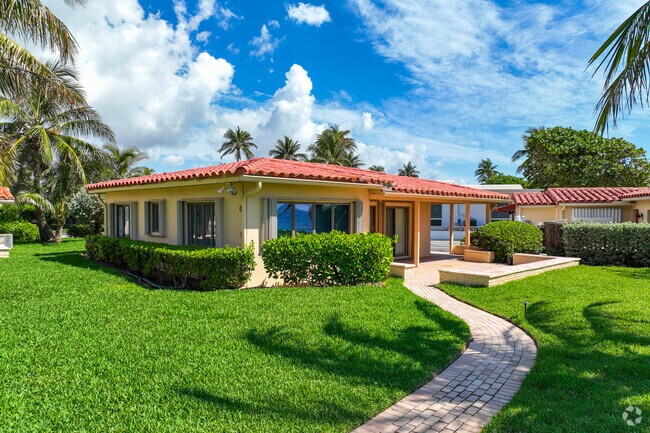 Colorful Mediterranean style single family home in Deerfield Beach neighborhood.