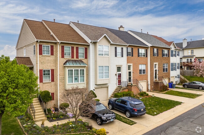 Most homes in Spring Ridge, including townhomes, have garages and modest backyards.