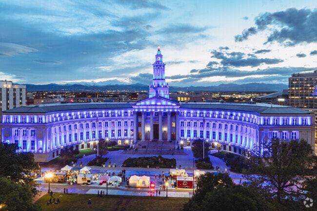 The Denver District Court Building downtown hosts community events in the nearby park, and at night, the building beautifully lights up, adding charm to the vibrant cityscape.