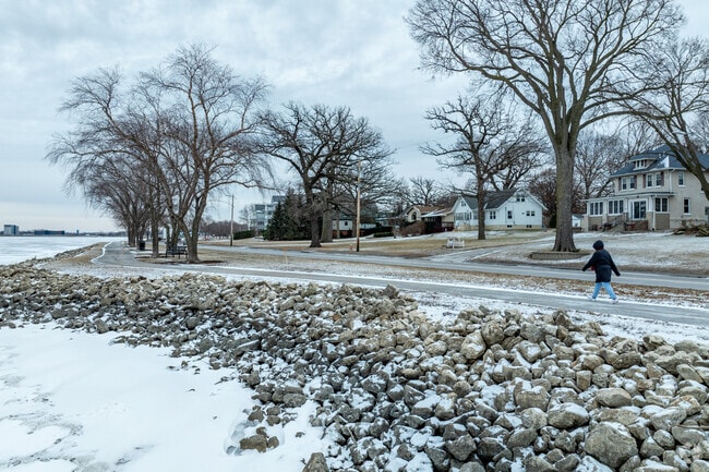 Even in the cold, East End locals enjoy the quiet beauty of the snowy river path.