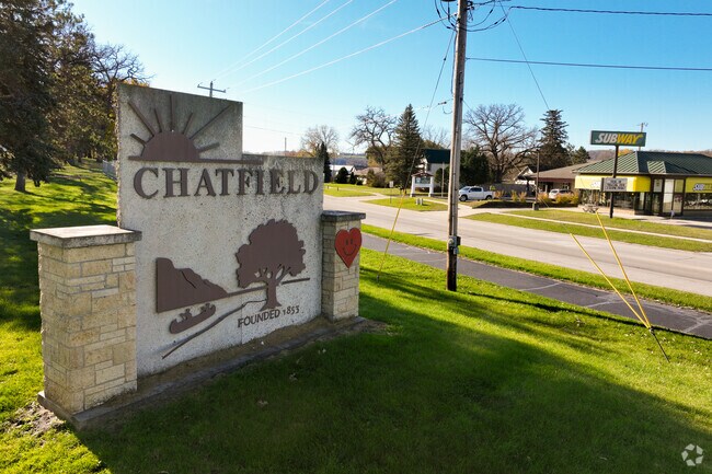 The Chatfield sign marks the town’s founding in 1853 along historic Route 52.