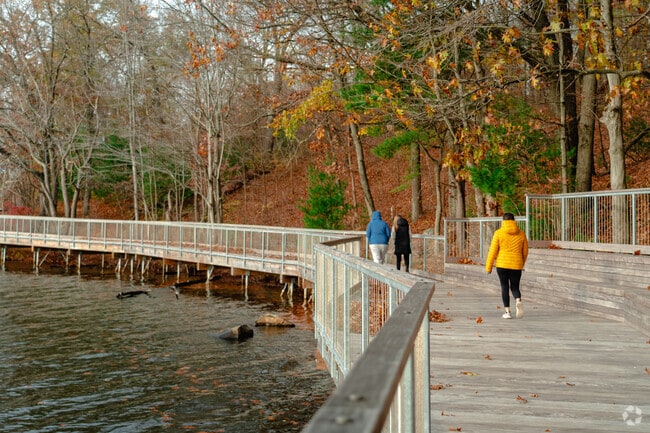 Locals walk along the boardwalk of Coes Pond near Cherry Vally.