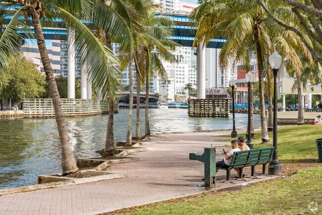 Jose Marti park walkway offers benches overlooking the Miami River in Riverside.