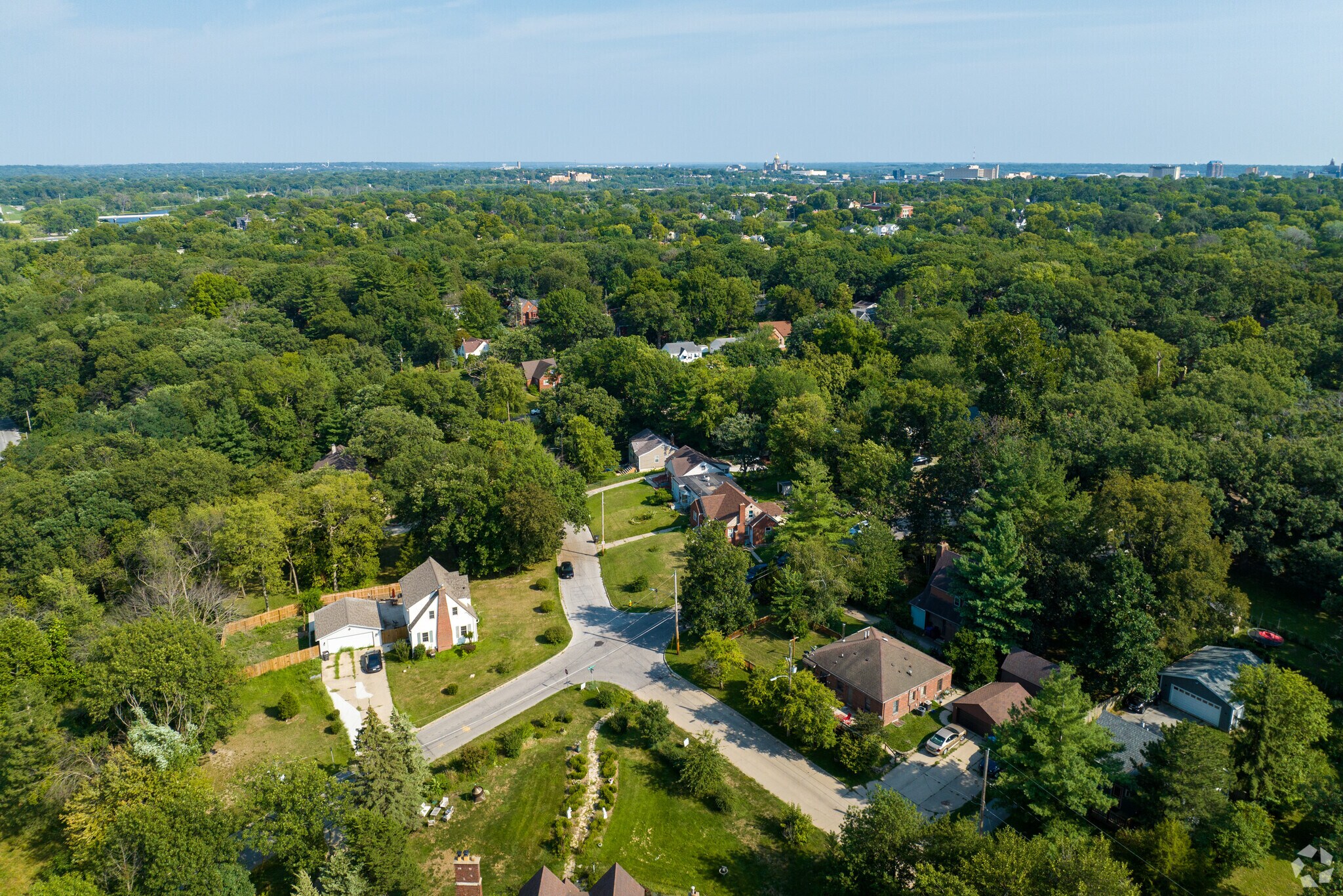 Mondamin Presidential features old, classic homes, winding hilly roads, and mature trees.