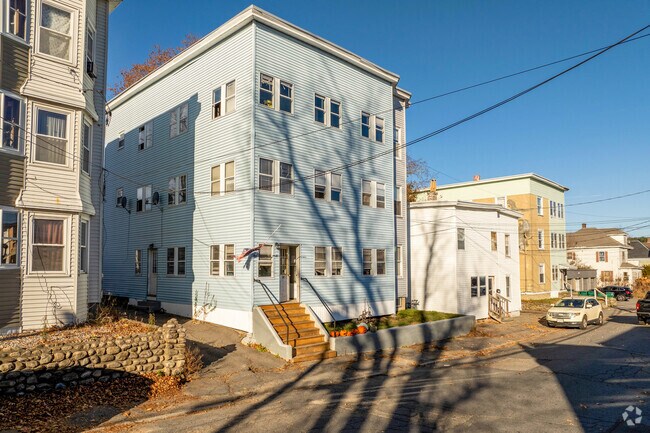 A row of multifamily homes in Cleghorn has boxy structures with three or more units.