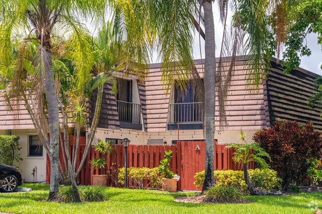 Townhomes in Jupiter Lakes offer a balcony and gated small porch.