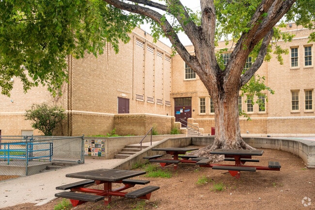 Steck Elementary has multiple shaded bench areas around the perimeter.