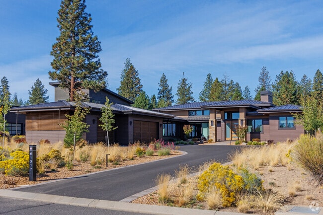 A contemporary Tetherow home with forest as a backyard and a golf course view.