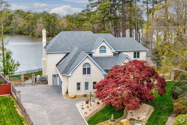Brick homes off Lake Smith in Bayside blend classic design with spacious two-story layouts.
