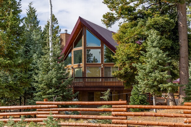Tucked among towering trees, chalet-style homes are a signature of Duck Creek Village living—offering cozy mountain charm and peaceful forest surroundings.
