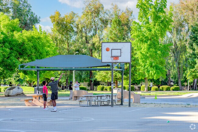 Locals gather for a game of basketball at Caldwell Park in Benton Tract.
