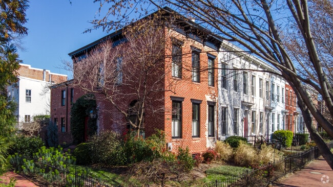 Beautifully painted and unpainted row homes contrast with each other in Capitol Hill.