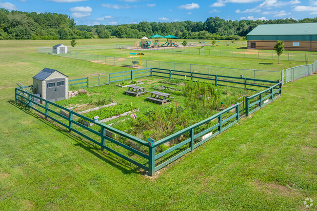 Next to the playground at the Harmony Elementary School is a small community garden.