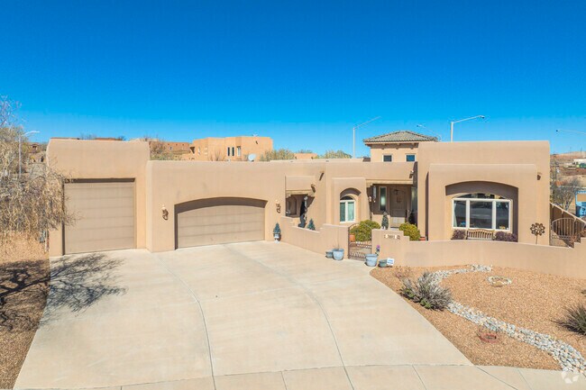 Pueblo style homes in High Resort feature flat roofs and stucco exteriors.