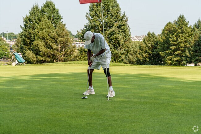 A golfer concentrates hard on sinking this putt at Willow Valley Golf Club in Lyndon.