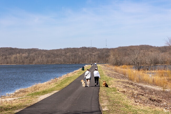 Lake Charleston Park has a paved path build on a levy across the lake.