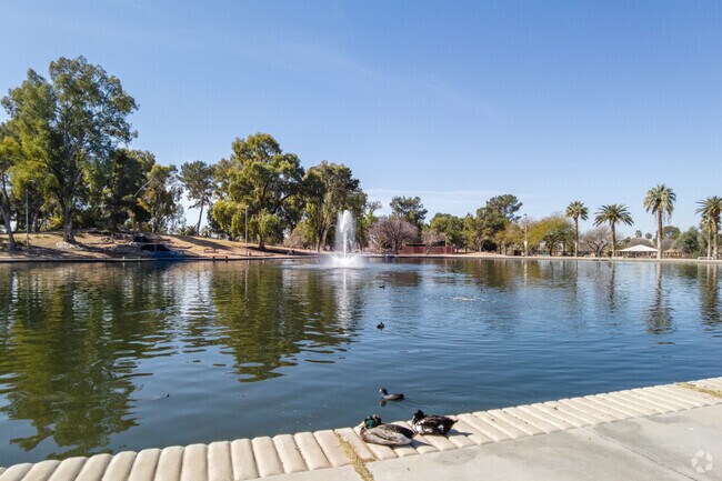 The Center Of Reid Park Features A Large Man-Made Pond That People Can Walk Around