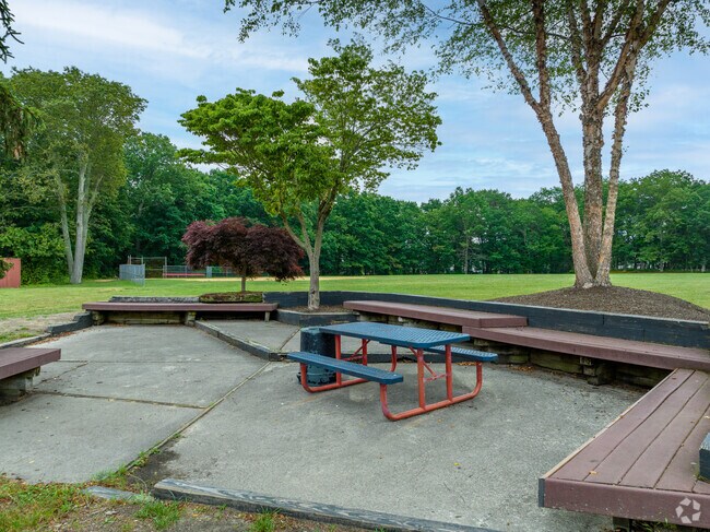 A small shaded seating area is located in the back of C.W Goetz Middle School.