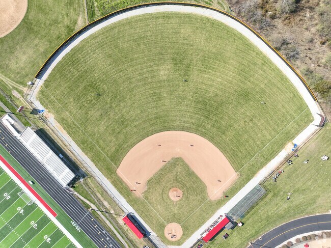 There is also a baseball field that is located near the back.