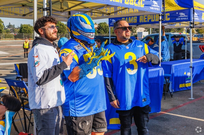 Football fans in South Inglewood show pride for their teams on game day at SoFi Stadium.