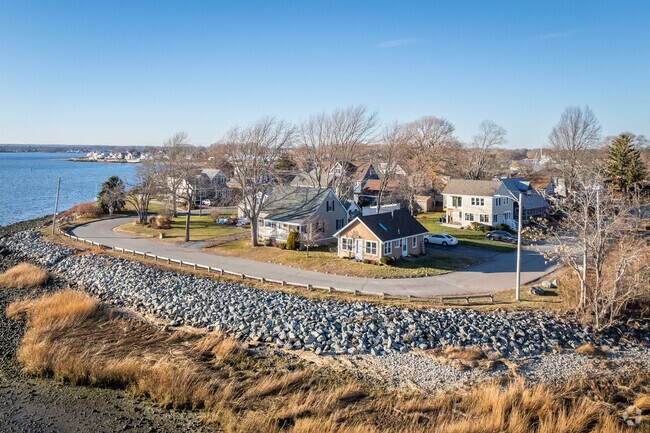 Experience Bay Spring's charm with waterfront homes visible from the sky.