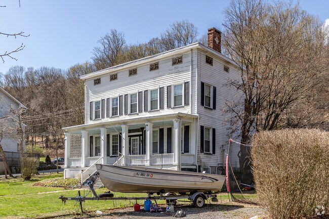 This historic Glen Gardner home showcases colonial-era charm with a wide porch and timeless details.