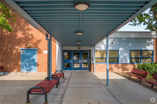 Benches line the entrance of Santa Fe Trail Elementary in Maple Crest.