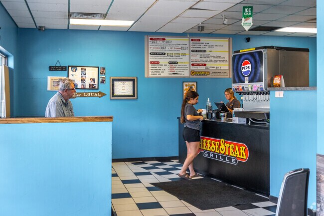 Grab a Philly cheese steak sandwich at CheeseSteak Grille near Salt Valley View.