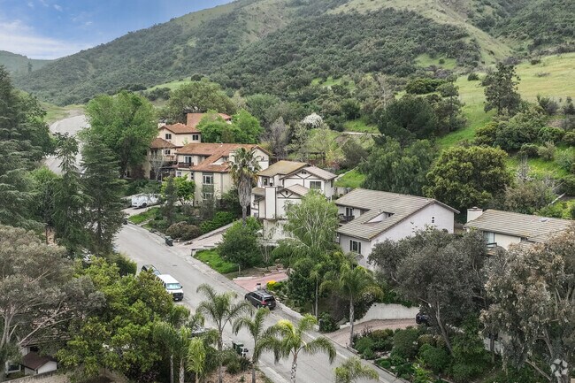 Traditional homes sit upon the lush hillside in Whizin's Row, located in Agoura Hills.