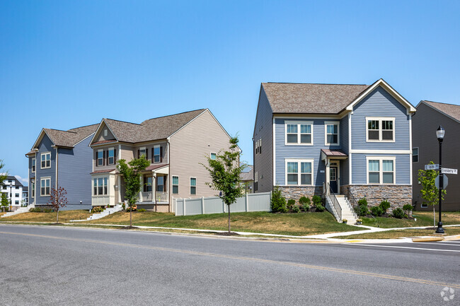 A charming row of newly built colonial revivals on a quiet street in Fredericktowne Village.