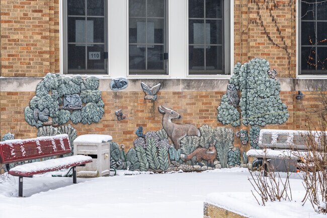 Garvy J Elementary School has a beautiful nature mural on the side of the building.