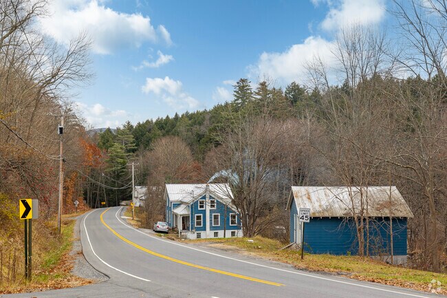 Homes in Day often reside alongside winding roads in dense forests of deciduous trees.