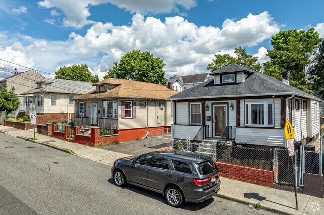 Totowa Section has cozy single-family bungalows with small front stoops.