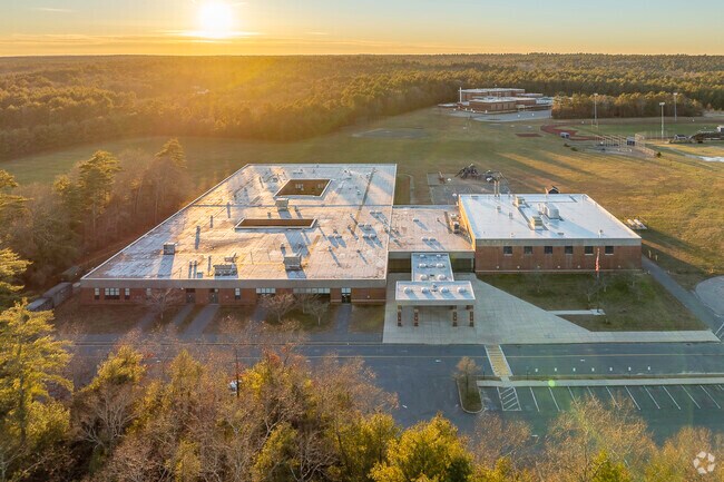 The sun sets on George R Austin Intermediate School in Lakeville, MA.