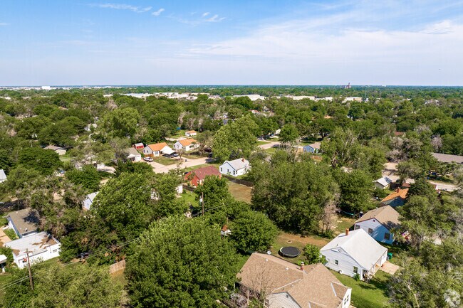 Tree-lined streets frame cozy homes in the Stanley/Aley neighborhood of Wichita.