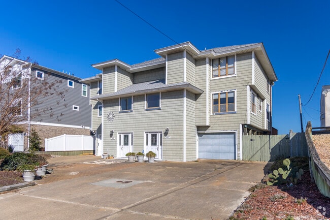 A sleek and modern beach duplex graces the streets of Chic's Beach.