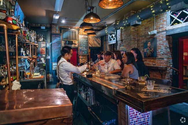 Knowledgeable bartenders craft cocktails at The Brick Room in Downtown Salisbury.