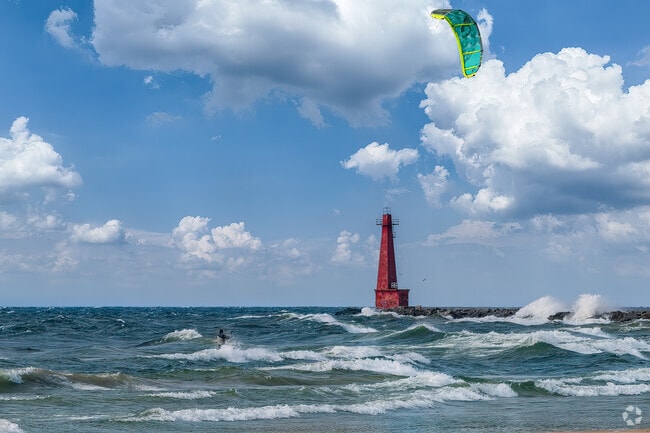 A kiteboarder enjoys a windy day on Lake Michigan near Nims.