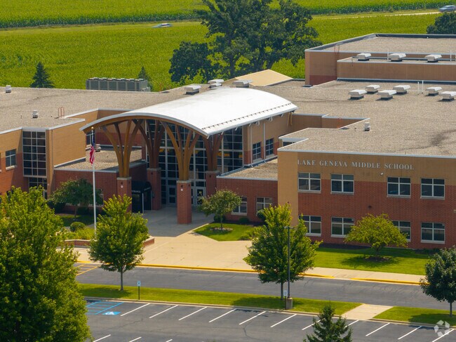 Arched entrance of Lake Geneva Middle School under a bright blue Wisconsin sky.