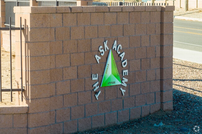 The Ask Academy sign and slogan.