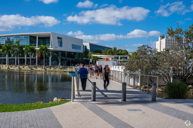 People walking across the Lakeside Walkway in Upper Riviera.