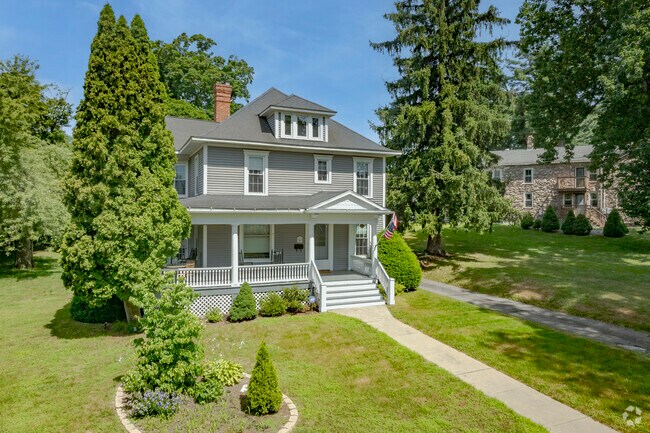 Traditional homes in Plymouth often have porches and mature gardens.