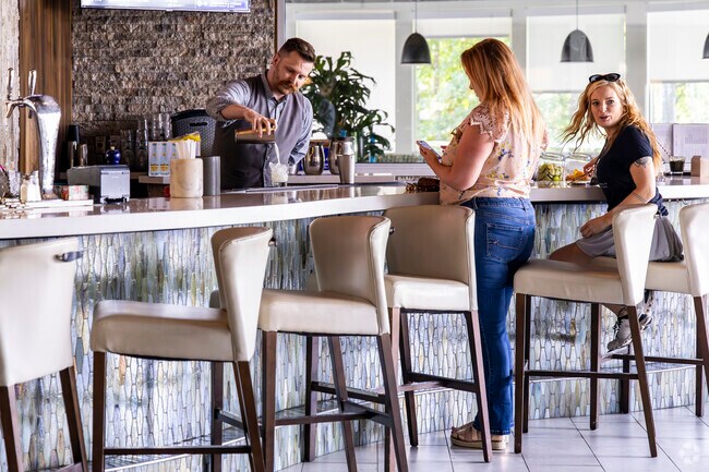 Grab a drink with friends at the bar located in Javi's near The Crossing.