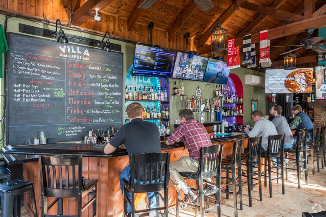 Enjoy time with friends and watch sports over specialty pizza at Villa Capri in Doylestown.