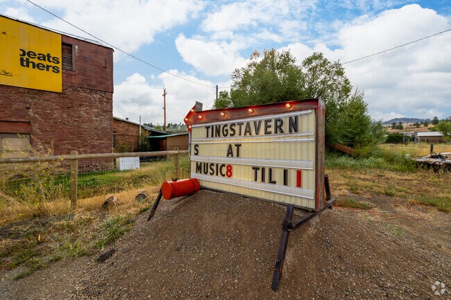 A rustic sign marks the entrance to Ting's Tavern, a local favorite in Jefferson City.