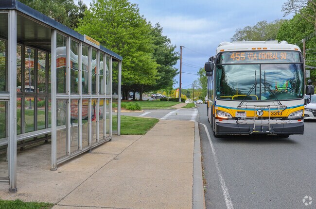 MBTA buses travel along Loring Avenue through Vinnin Square, offering convenient access to public transit.