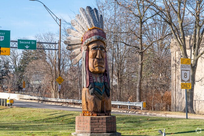 A 26-foot-high wood-carved sculpture depicting Chief Netawatwees greets visitors to Cuyahoga Falls near the Heslop Morningview neighborhood.
