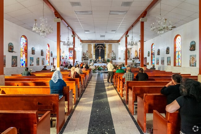 The congregation at Guardian Angel Church in Pacoima prepares themselves for service.